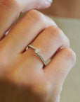 White gold solitaire ring with bypass-style band