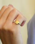 Round yellow gold signet ring 