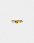 Ring with orange sapphire and white diamonds