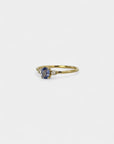 Ring with central indigo sapphire and white diamonds