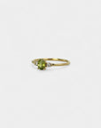 Ring with central green sapphire and white diamonds