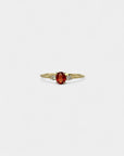 Ring with central orange sapphire and white diamonds