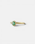 Yellow gold ring with oval emerald and rounded bezel
