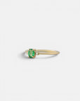 Yellow gold ring with oval emerald and two white diamonds