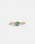 Yellow gold ring with oval emerald and two white diamonds