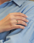 Yellow gold ring with oval emerald and two white diamonds