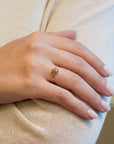 Yellow gold ring with champagne diamond and decorated bezel