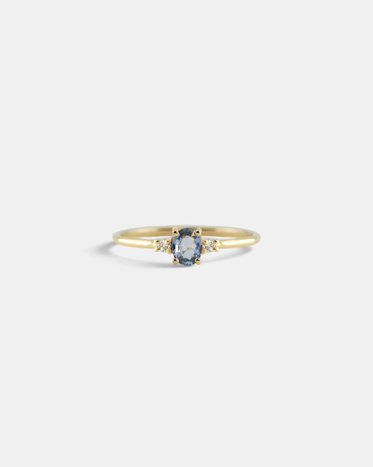 Ring with light blue sapphire and white diamonds