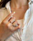 Ring with central orange sapphire and white diamonds
