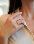 Ring with central light blue sapphire and white diamonds