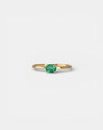 Yellow gold ring with horizontal oval emerald