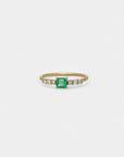 Ring with rectangular emerald and white diamonds