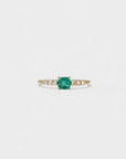 Ring with square emerald and white diamonds