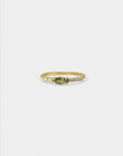 Yellow gold ring with marquise green sapphire and white diamonds