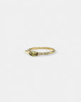 Yellow gold ring with marquise green sapphire and white diamonds