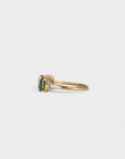 Ring with oval green sapphires and white diamonds