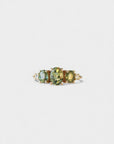 Ring with oval green sapphires and lateral white diamonds