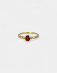 Yellow gold ring with cabochon garnet and white diamonds
