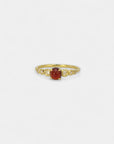 Yellow gold ring with cabochon garnet and white diamonds in scale