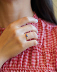 Yellow gold ring with blue sapphire and round elements with white diamonds