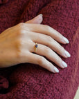 Yellow gold ring with blue sapphire and round elements with white diamonds