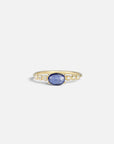 Yellow gold ring with blue sapphire and round elements with white diamonds