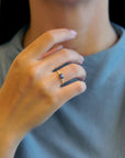 Yellow gold ring with blue sapphire and round elements with white diamonds