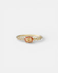 Yellow gold ring with yellow sapphire and round elements with white diamonds