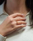 Yellow gold ring with heart-shaped orange corundum and two white diamonds