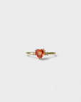 Yellow gold ring with orange heart-shaped synthetic corundum and two white diamonds