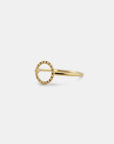 Yellow gold ring with round profile of white diamonds
