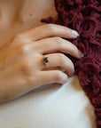 Yellow gold ring with square iolite and white diamonds