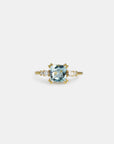 Yellow gold ring with square blue topaz and white diamonds