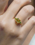 Yellow gold ring with square lemon quartz and side peridots