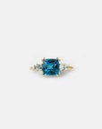 Yellow gold ring with square London blue topaz and side topaz and aquamarine