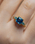 Yellow gold ring with square London blue topaz and side topaz and aquamarine