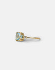 Yellow gold ring with square light blue topaz and side topaz and aquamarine