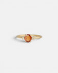 Yellow gold ring with burnt orange sapphire ​​and white diamonds