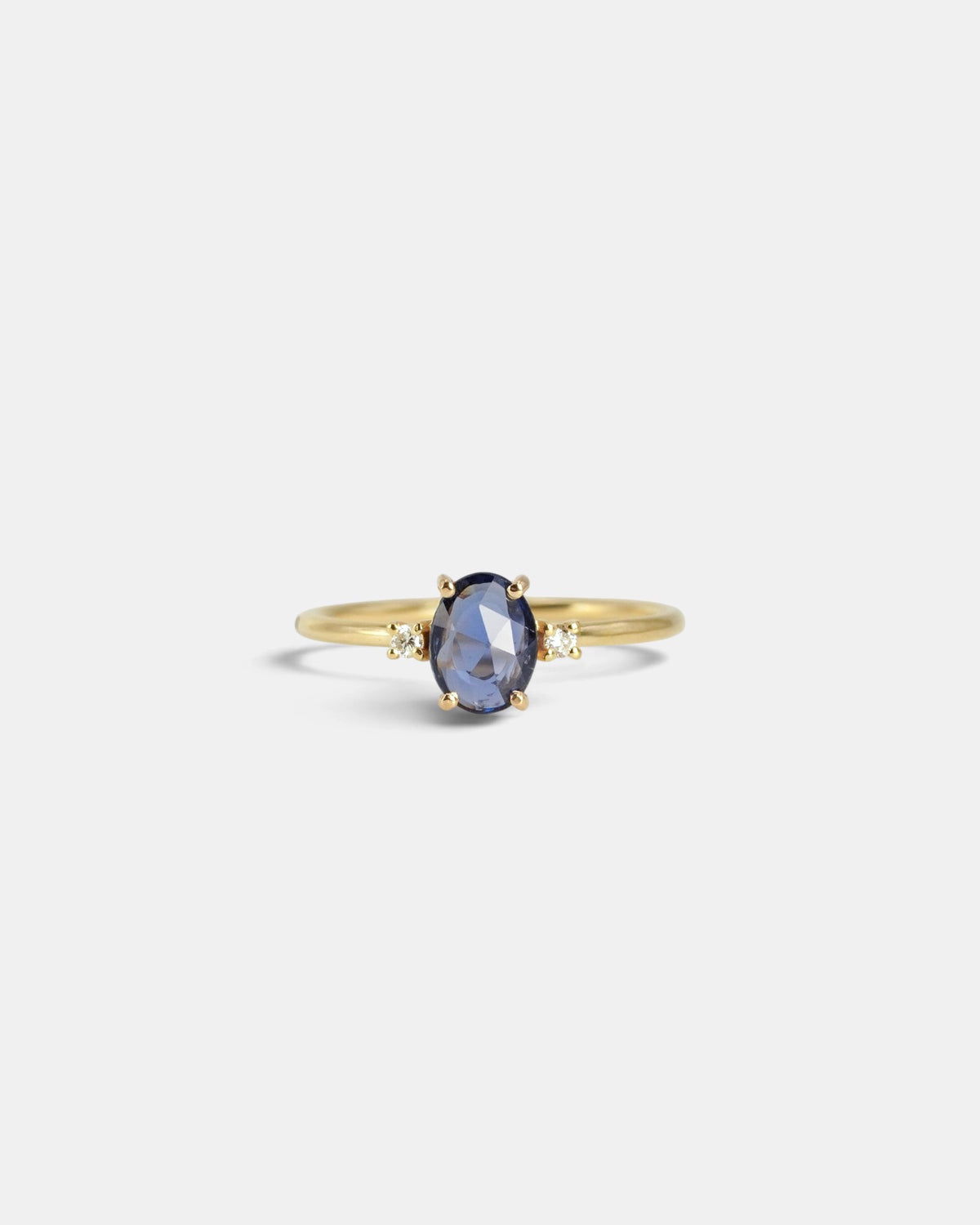 Yellow gold ring with oval rose-cut blue sapphire and white diamonds
