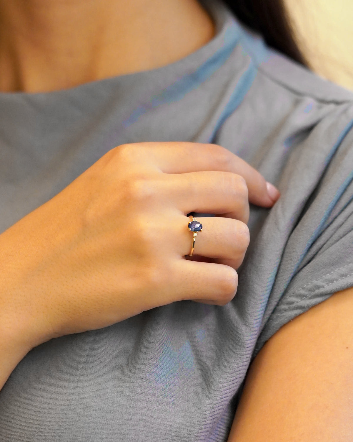 Yellow gold ring with oval rose-cut blue sapphire and white diamonds