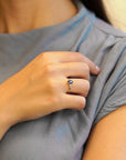 Yellow gold ring with oval rose-cut blue sapphire and white diamonds