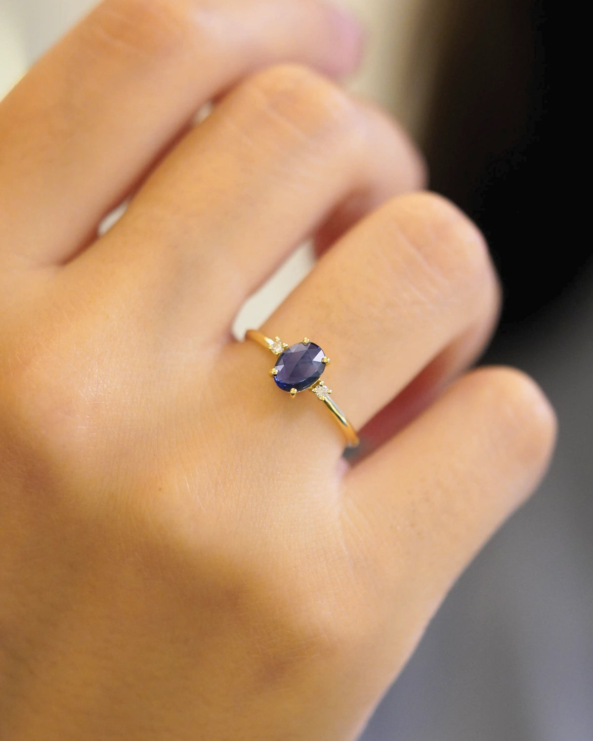Yellow gold ring with oval rose-cut blue sapphire and white diamonds