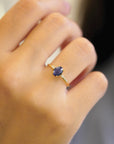 Yellow gold ring with oval rose-cut blue sapphire and white diamonds