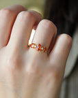Yellow gold ring with oval rose-cut orange sapphires and white diamonds