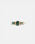 Yellow gold ring with teal tourmalines and white diamonds