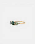 Yellow gold ring with teal tourmalines and white diamonds