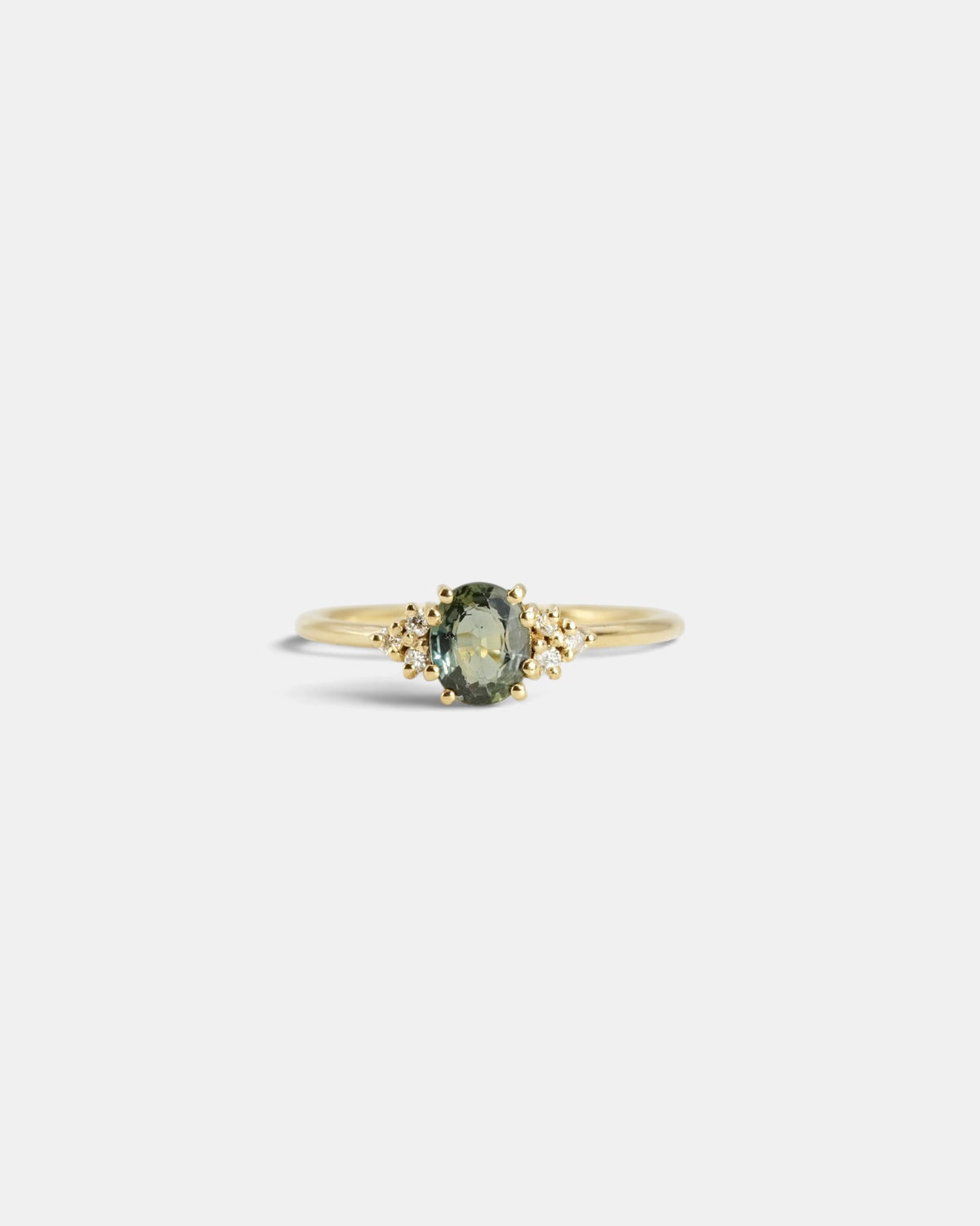 Anello in oro giallo con zaffiro verde scuro e diamanti bianchi