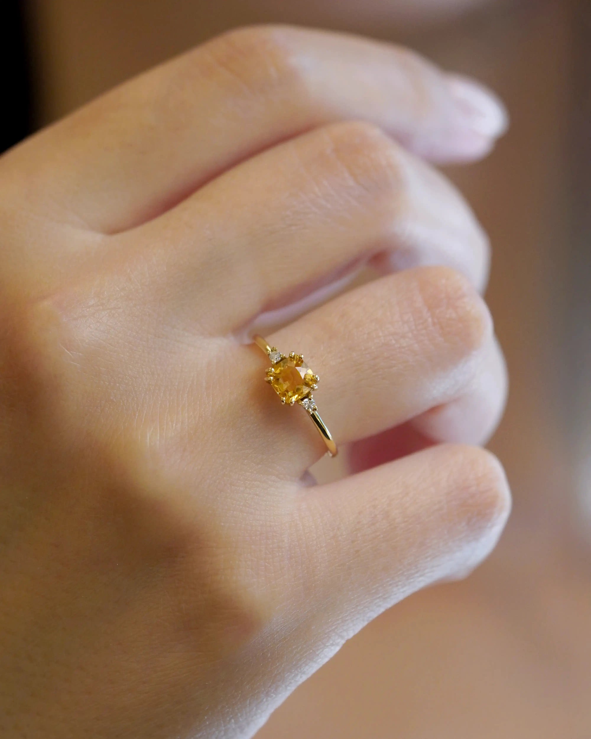 Yellow gold ring with square citrine and two white diamonds