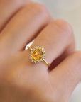 Yellow gold ring with oval citrine and white diamond contour