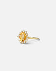 Yellow gold ring with oval citrine and white diamond contour